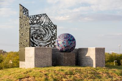 Total of ten of sculptures the eight planets (Mercury, Venus, Earth, Mars, Jupiter, Saturn, Uranus, and Neptune), the sun, and dwarf planet Pluto. The planets are concrete with mosaic and scaled at 1:11 billion scale throughout the Park. 