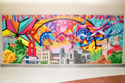 Two murals painted on polytab adhered to MDO panels 1. Features cultural destinations like the North Star Boots and San Antonio Museum of Art. 2. Features the Mission San Jose rose window, McNay Art Museum, and San Fernando Cathedral.