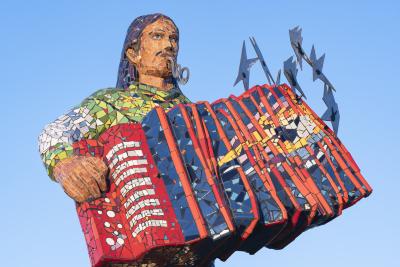 Male accordion player made of mosaic with stainless steel legs